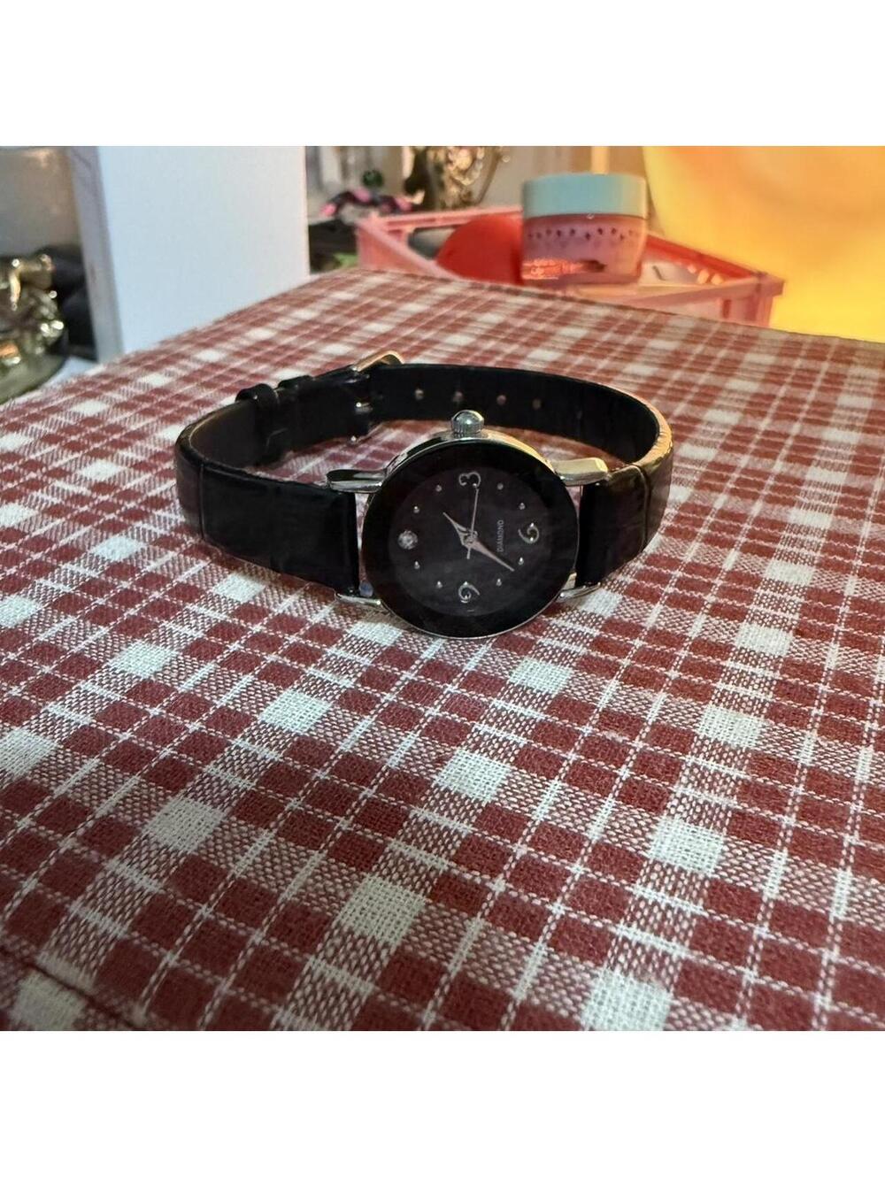 Avon diamond accent watch with black leather strap